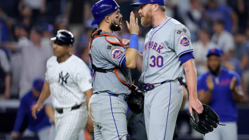 New York Mets relief pitcher Jake Diekman and catcher catcher Luis Torrens celebrate a victory