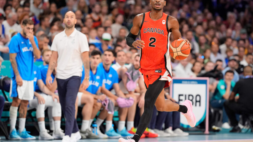 Canada guard Shai Gilgeous-Alexander dribbling up the floor against Greece