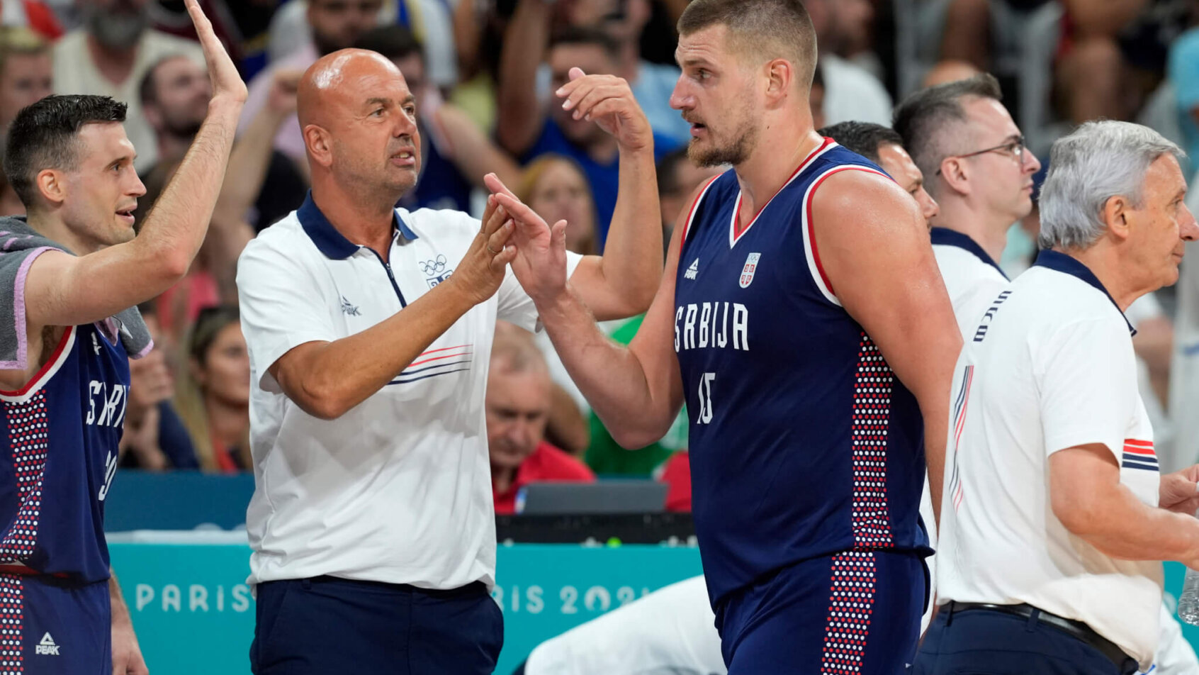 Nikola Jokic celebrating with Serbian teammates