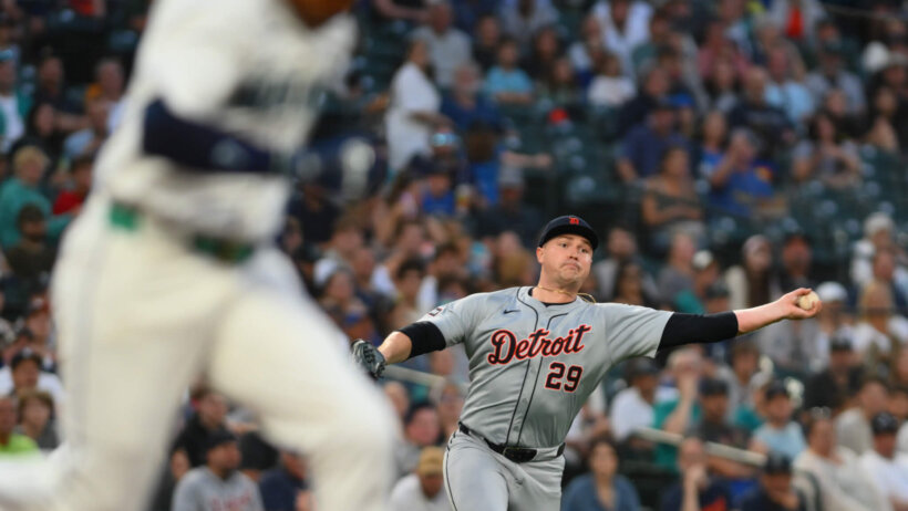 Detroit Tigers starting pitcher Tarik Skubal throws to first base