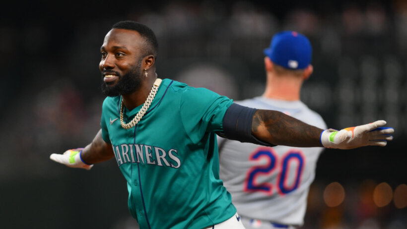 Seattle Mariners left fielder Randy Arozarena celebrates scoring a run