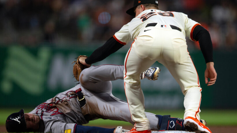 San Francisco Giants third baseman Matt Chapman tags out Atlanta Braves outfielder Jarred Kelenic