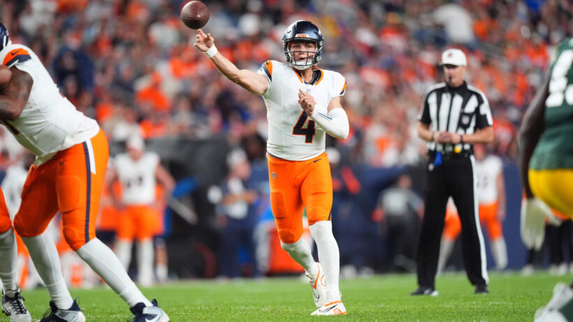 Denver Broncos quarterback Zach Wilson throwing a pass