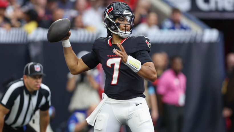 CJ Stroud throwing a football