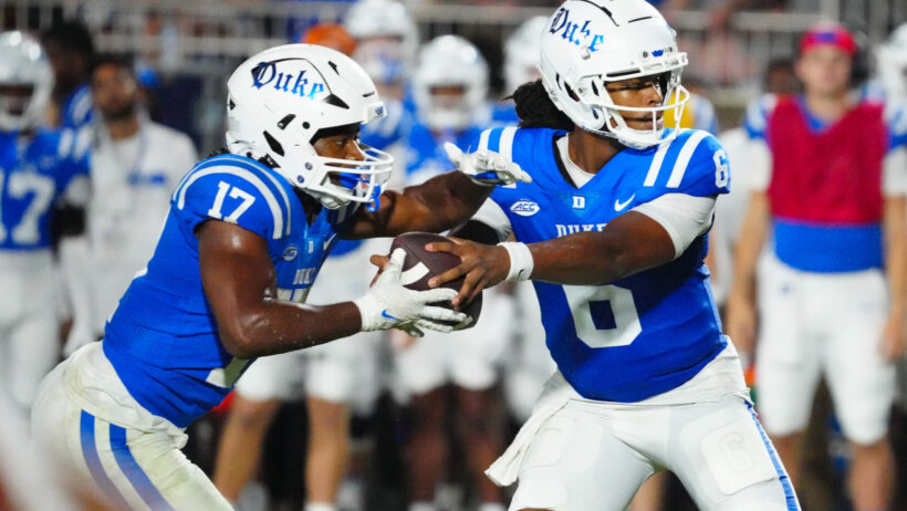 Duke Blue Devils quarterback Maalik Murphy goes to hand the ball off too running back Star Thomas