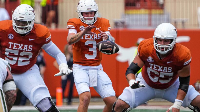 Texas Longhorns quarterback Quinn Ewers receives the snap
