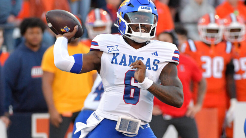 Kansas Jayhawks quarterback Jalon Daniels passes the ball