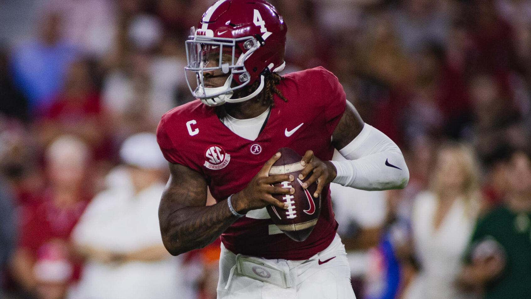 Alabama Crimson Tide quarterback Jalen Milroe looks for a pass
