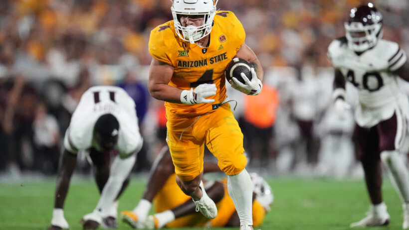 Arizona State running back Cam Skattebo runs the ball