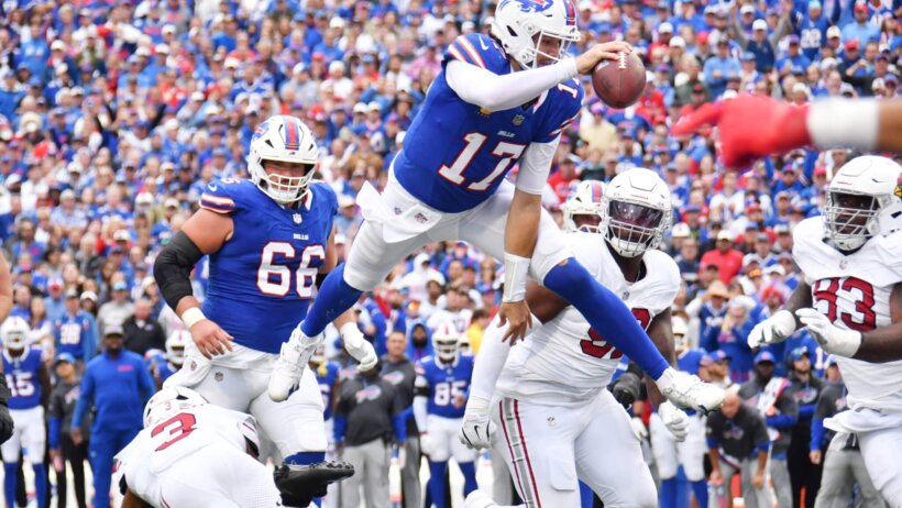 Josh Allen leaps over defender