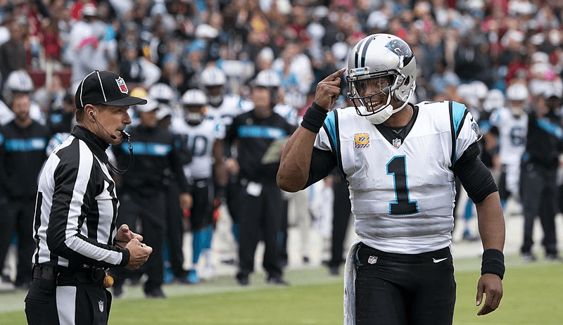 Cam Newton talking to the referee