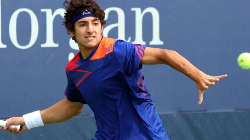 Cristian Garin prepares to hit shot