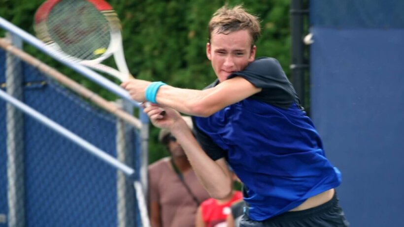 Danill Medvedev hitting return shot