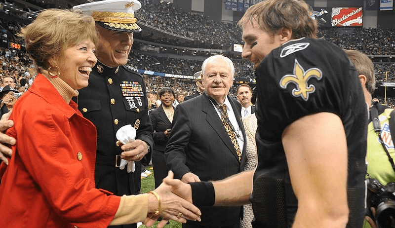 Drew Brees shaking hands with a military family