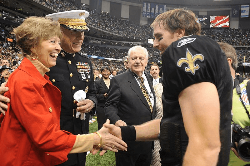 Drew Brees shaking hands with a military family