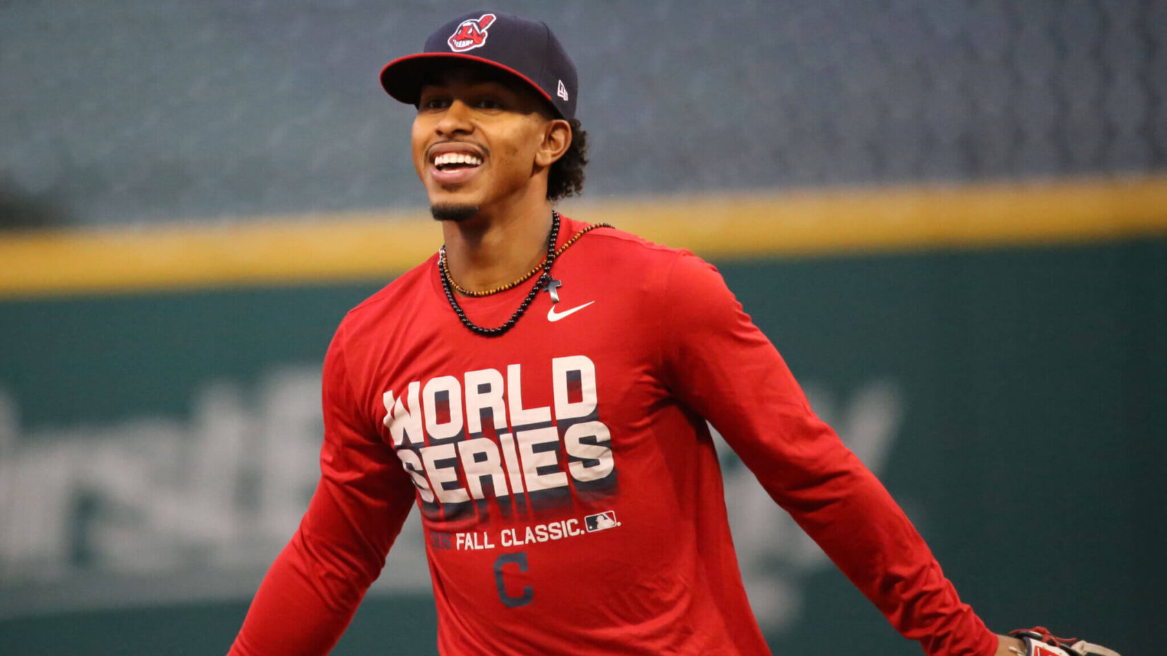 Indians SS Francisco Lindor smiling on the field during warmup.