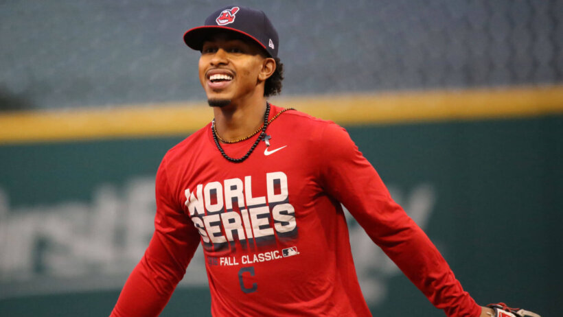 Indians SS Francisco Lindor smiling on the field during warmup.