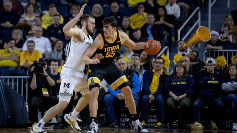 Iowa's Luka Garza backing down Michigan's Austin Davis