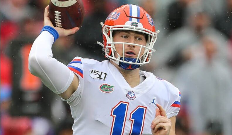Kyle Trask winds up to throw