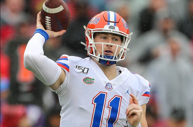 Kyle Trask winds up to throw