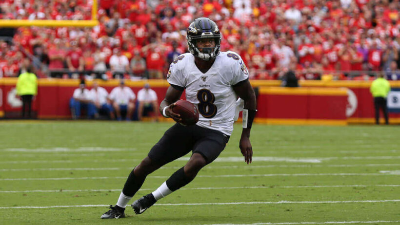 Lamar Jackson running with football