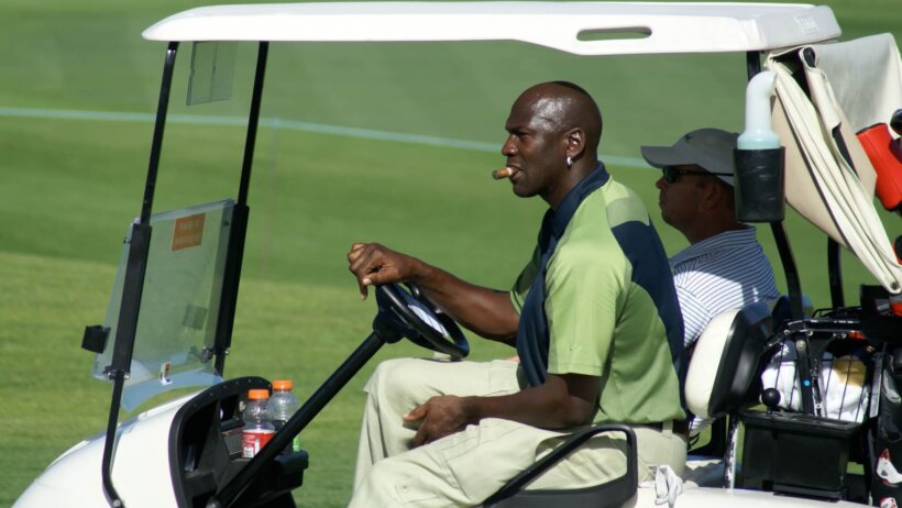 MJ rides golf cart