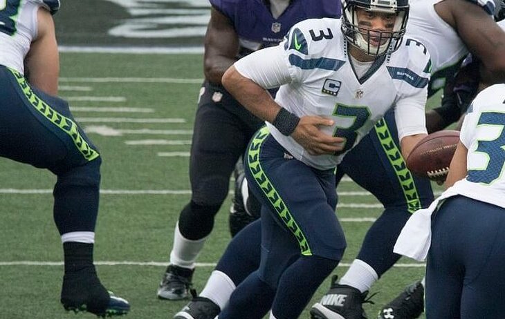 Russell Wilson handing the ball off.