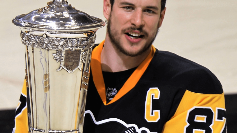 Sidney Crosby holding the Prince of Wales Trophy