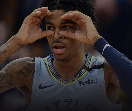 ja morant holding his hands as if they were goggles