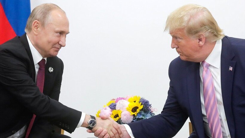 Trump shaking hands with Putin