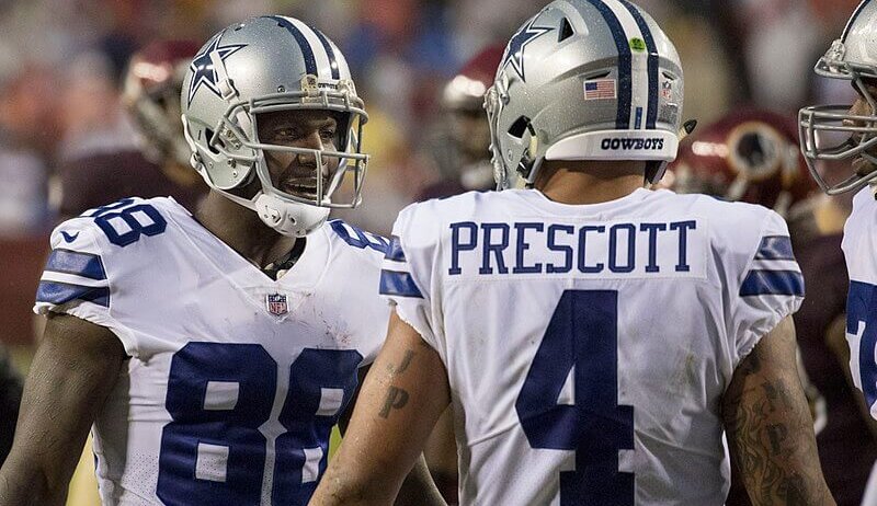 Dak Prescott talking to his receivers.