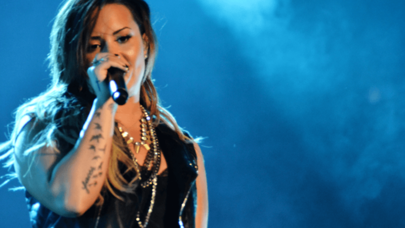 Demi Lovato performing a song.