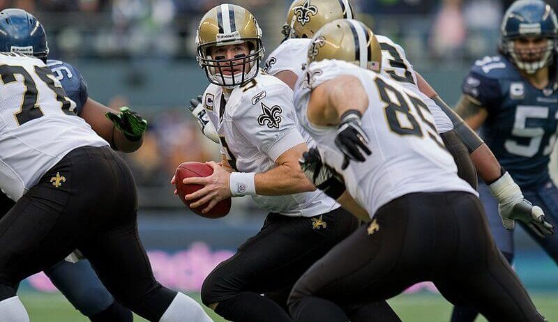 Drew Brees handing the ball off.