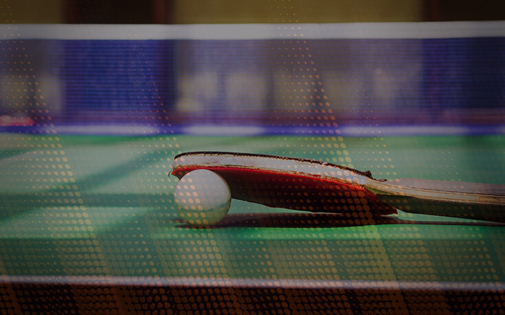 table tennis paddle and ball