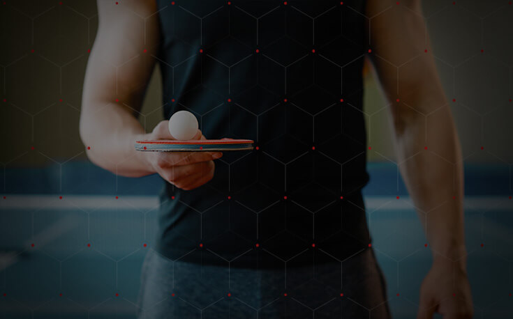 table tennis player balancing ball on paddle