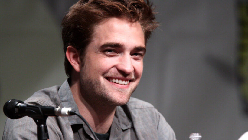 Robert Pattinson sitting