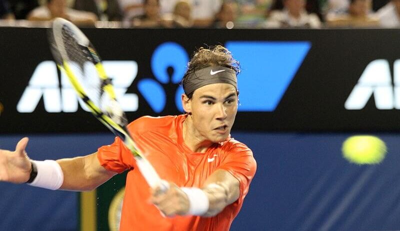 Rafael Nadal returns a ball.