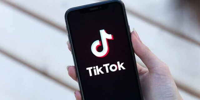 The TikTok logo on a cell phone.