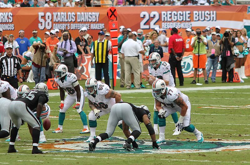 Miami Dolphins playing the Oakland Raiders.