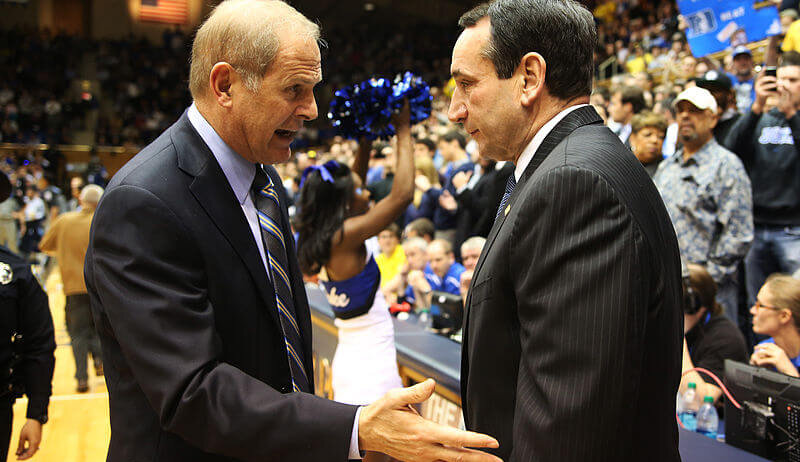 Duke coach Mike Krzyzewski shaking hands with Michigan coach Jon Beilein.