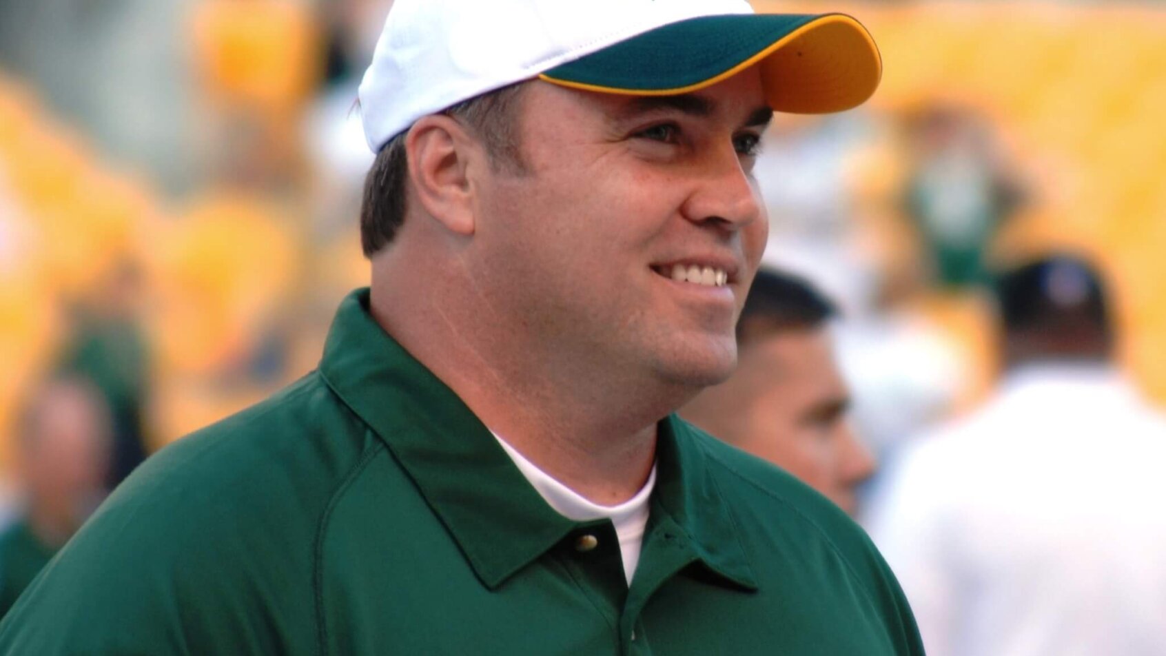 Mike McCarthy smiling on the sidelines
