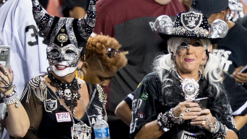 Raiders fans watching a game