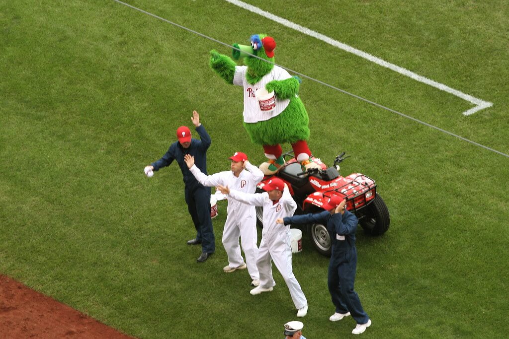 Phillies players on the field with the Phanatic