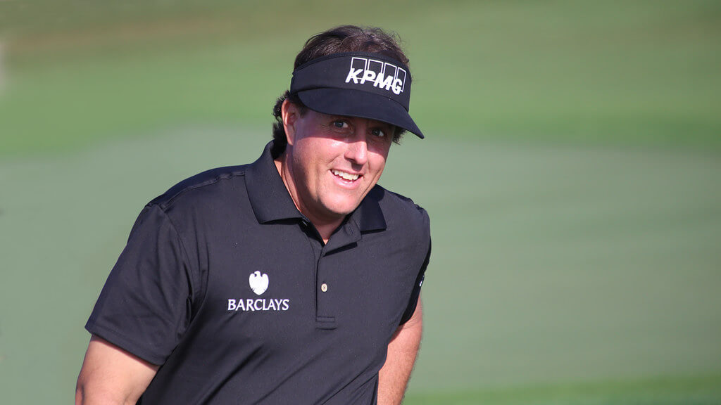 Phil Mickelson walking up to his ball.