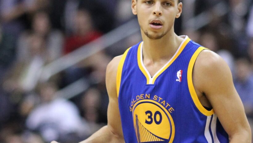 Steph Curry dribbles the basketball.