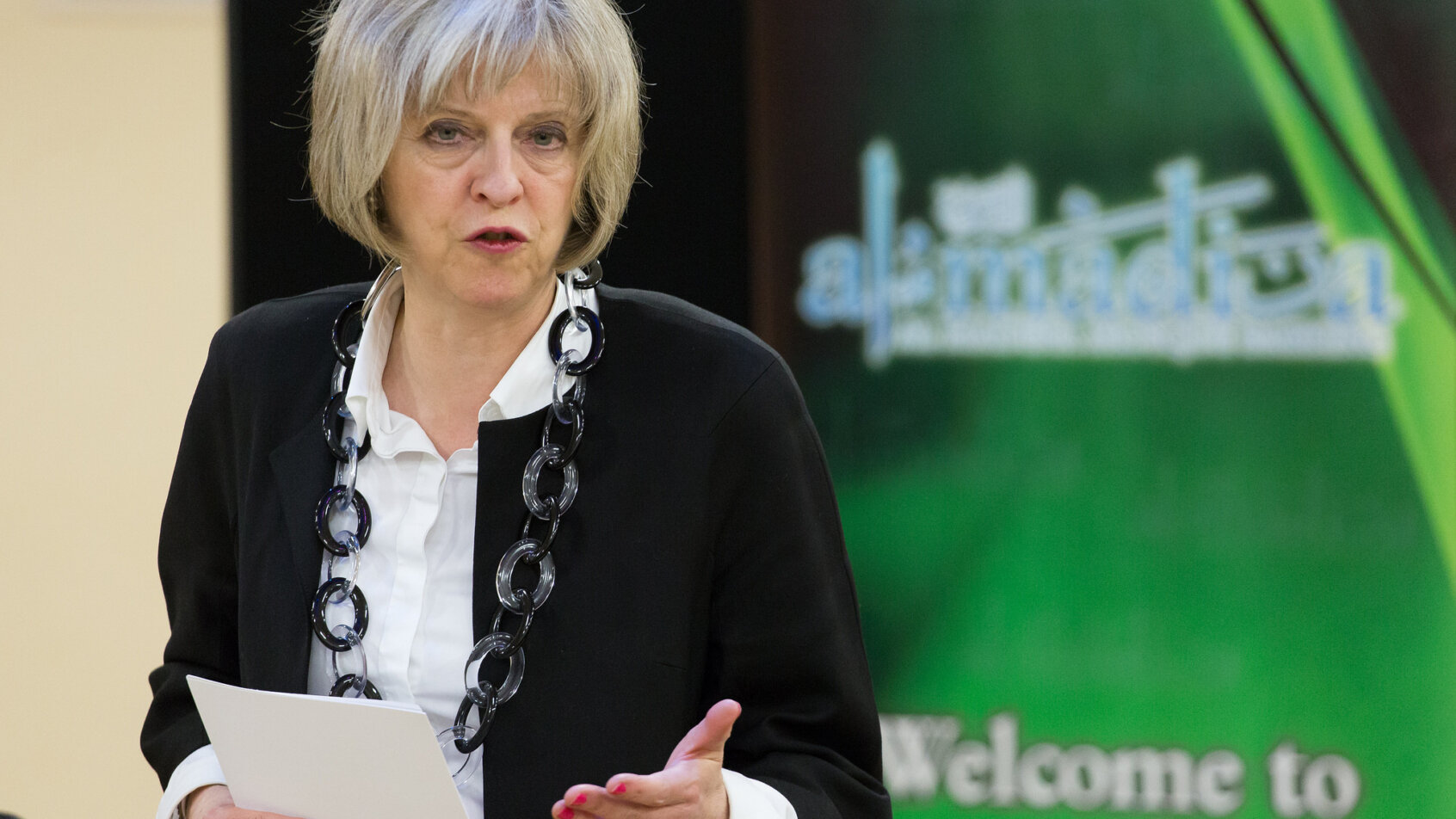 Theresa May Delivers a Speech Onstage