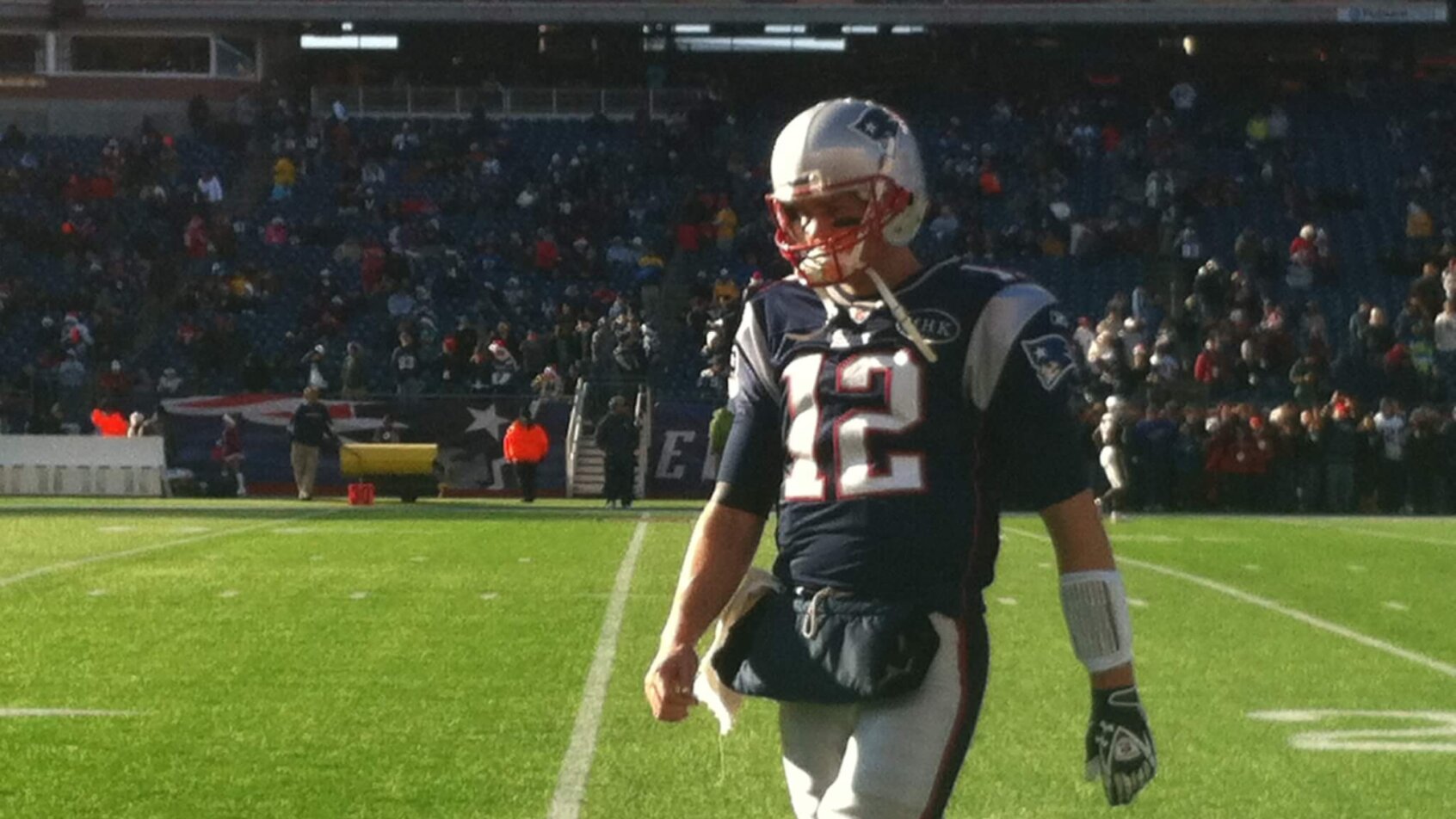 Tom Brady walks off the field.