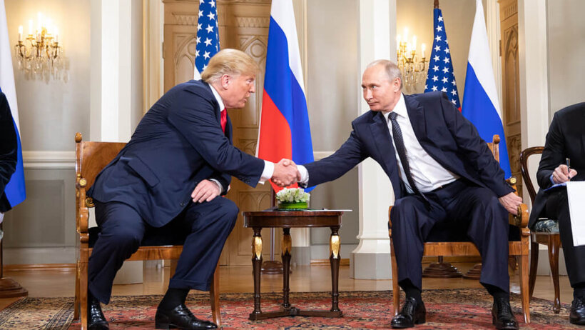 Donald Trump and Putin shake hands in Helsinki.